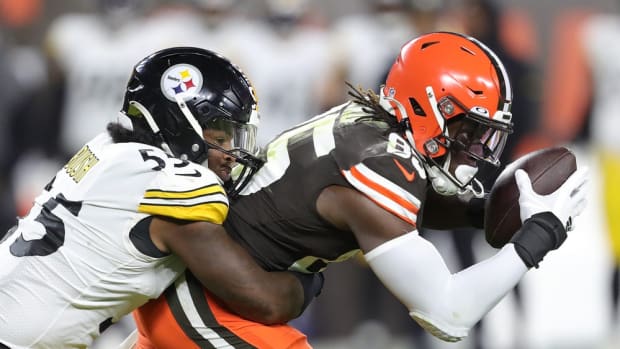 Browns tight end David Njoku is brought down by Steelers linebacker Devin Bush after gaining a first-half first down Thursday, Sept. 22, 2022, in Cleveland. Brownssteelers 26